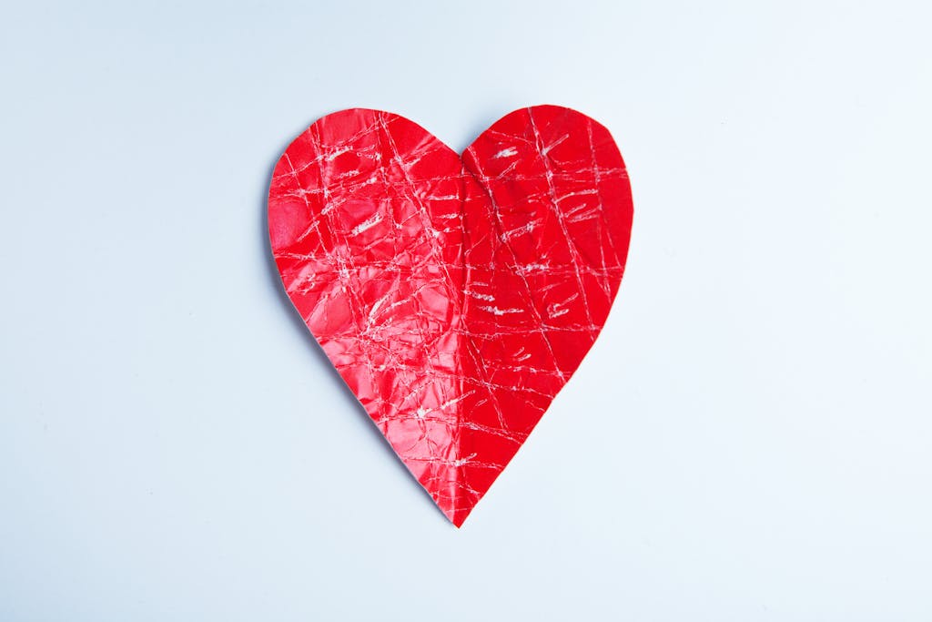 A vibrant red heart shape on a white background, ideal for love and romantic themes.